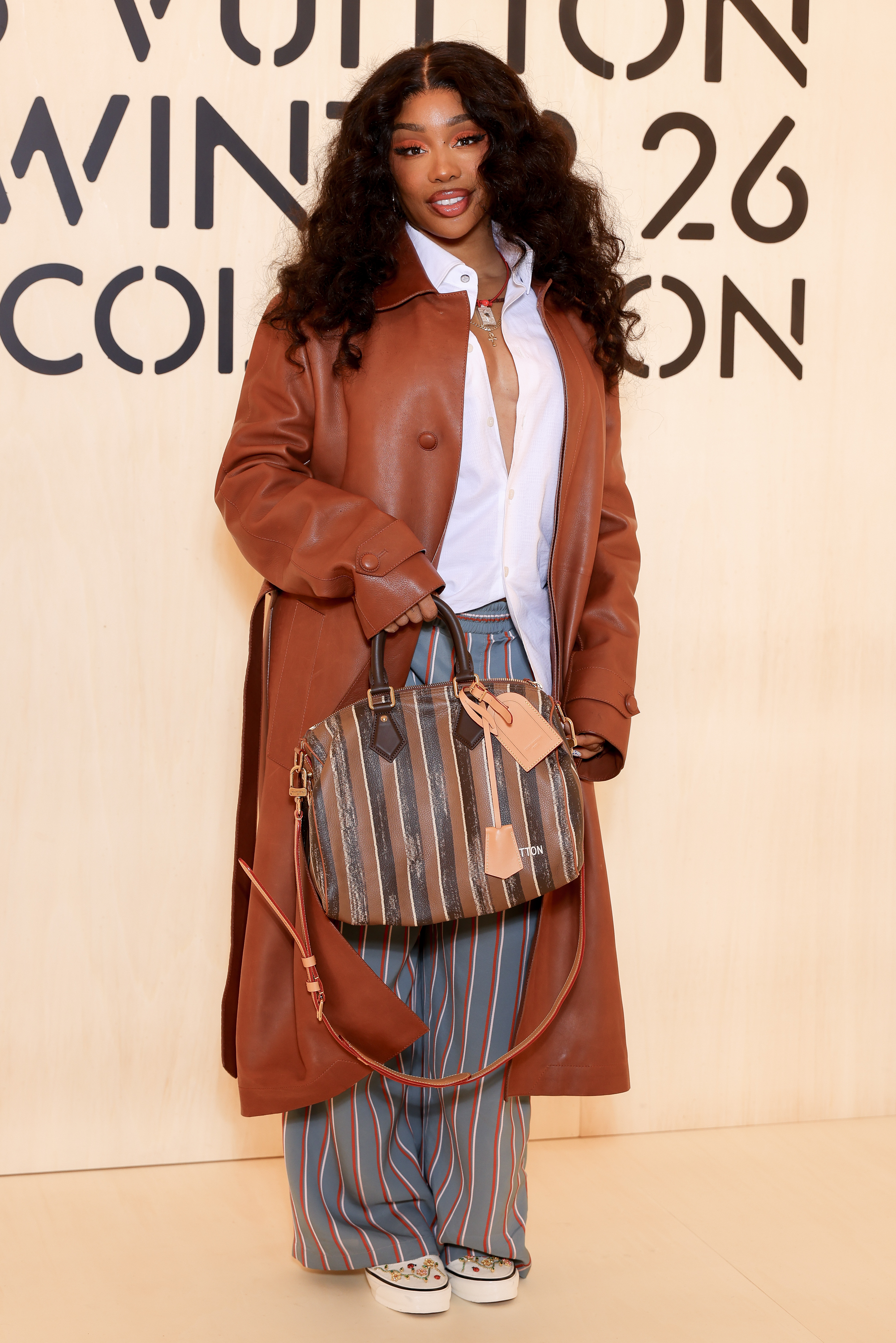 SZA attended the Louis Vuitton menswear show in custom Vans sneakers
