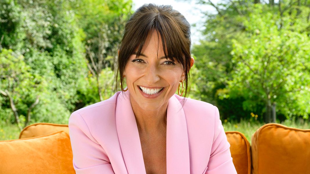 Davina McCall photographed for My Mum, Your Dad in a pink suit (headshot)