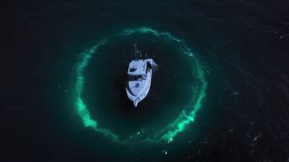 A boat surrounded by lights in Netflix&#039;s Investigation Alien.