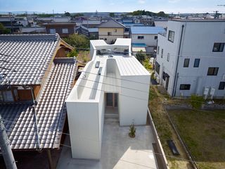 View from above of X-shaped 'Oshikamo' house during the day