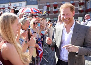 Prince Harry, Duke of Sussex meet members of the public as they leave the town hall during the Invictus Games Dusseldorf 2023 - One Year To Go events, on September 06, 2022 in Dusseldorf, Germany.