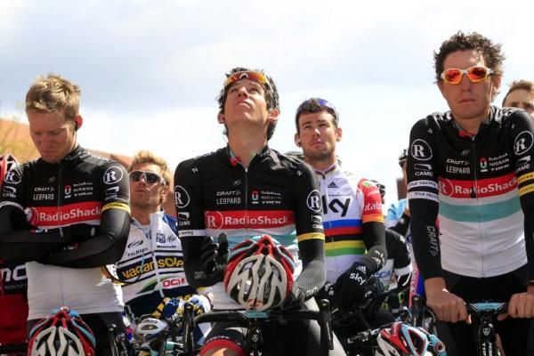 RadioShack-Nissan riders observe a minute of silence at the 2012 Giro in memory of Belgian cyclist Wouter Weylandt.