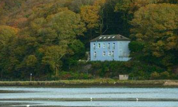 The bright blue house is a well-known landmark