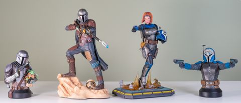 The Mandalorian and Bo-Katan Kryze Mini Busts and statues from Gentle Giant, lined up against a green background
