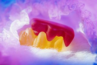 Two bear-shaped sweets 'embracing', close-up