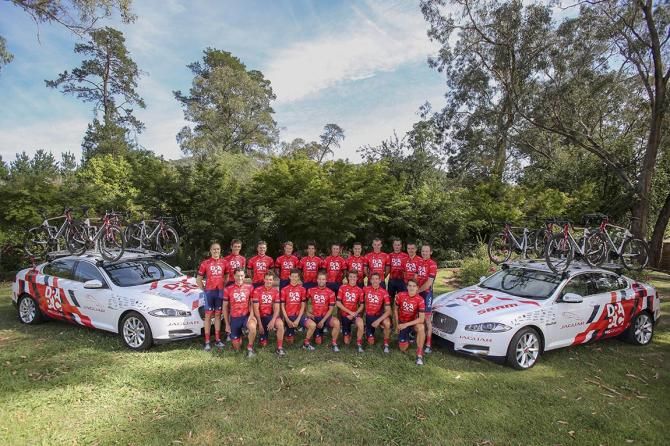 The 2015 Drapac squad flanked by two Jaguars after the training camp in Bright