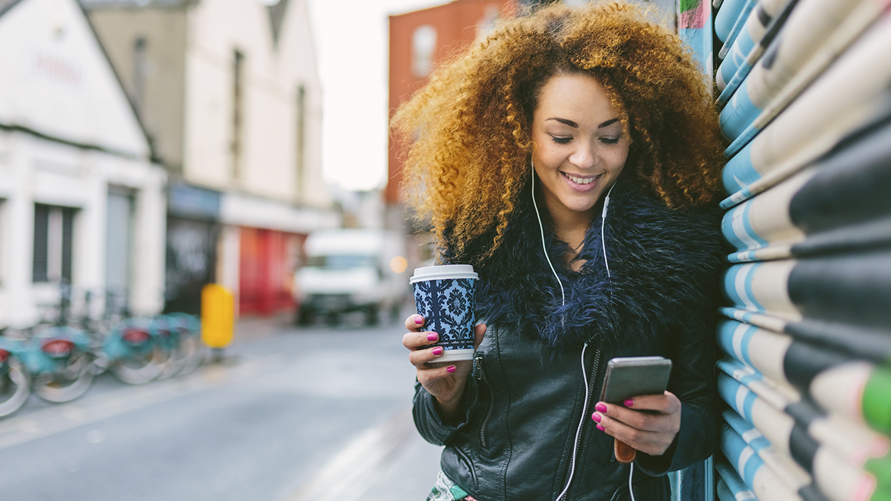 Apple Music vs Amazon Music Unlimited: Woman listening to music