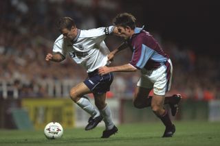 Tottenham's David Howells and West Ham's Stan Lazaridis compete for the ball in a Premier League game in August 1997.