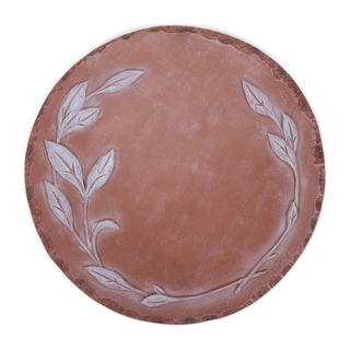 A stepping stone with an embossed leaf laurel