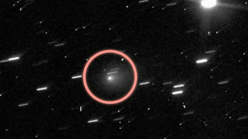 A white dot is circled amid lots of light streaks against a dark background.