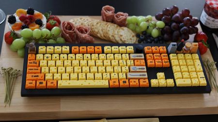 DirkMcGirk's mechanical cheeseboard on a platter of fruits and crackers