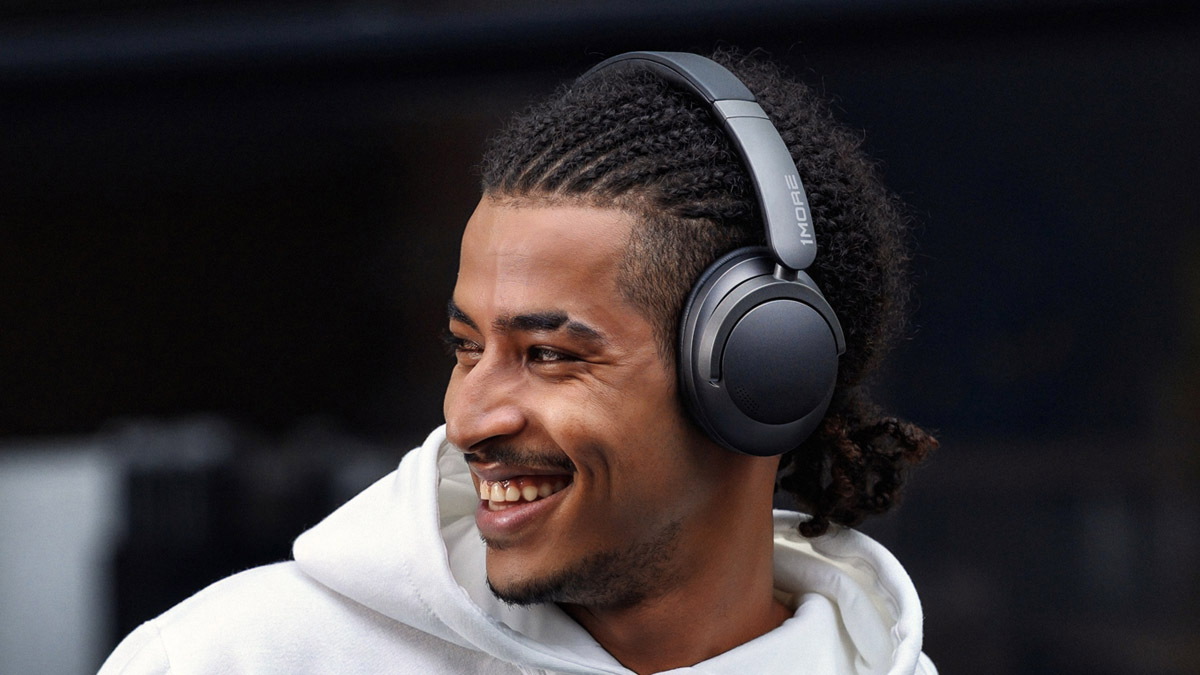 Closer view of man wearing 1More SonoFlow headphones.