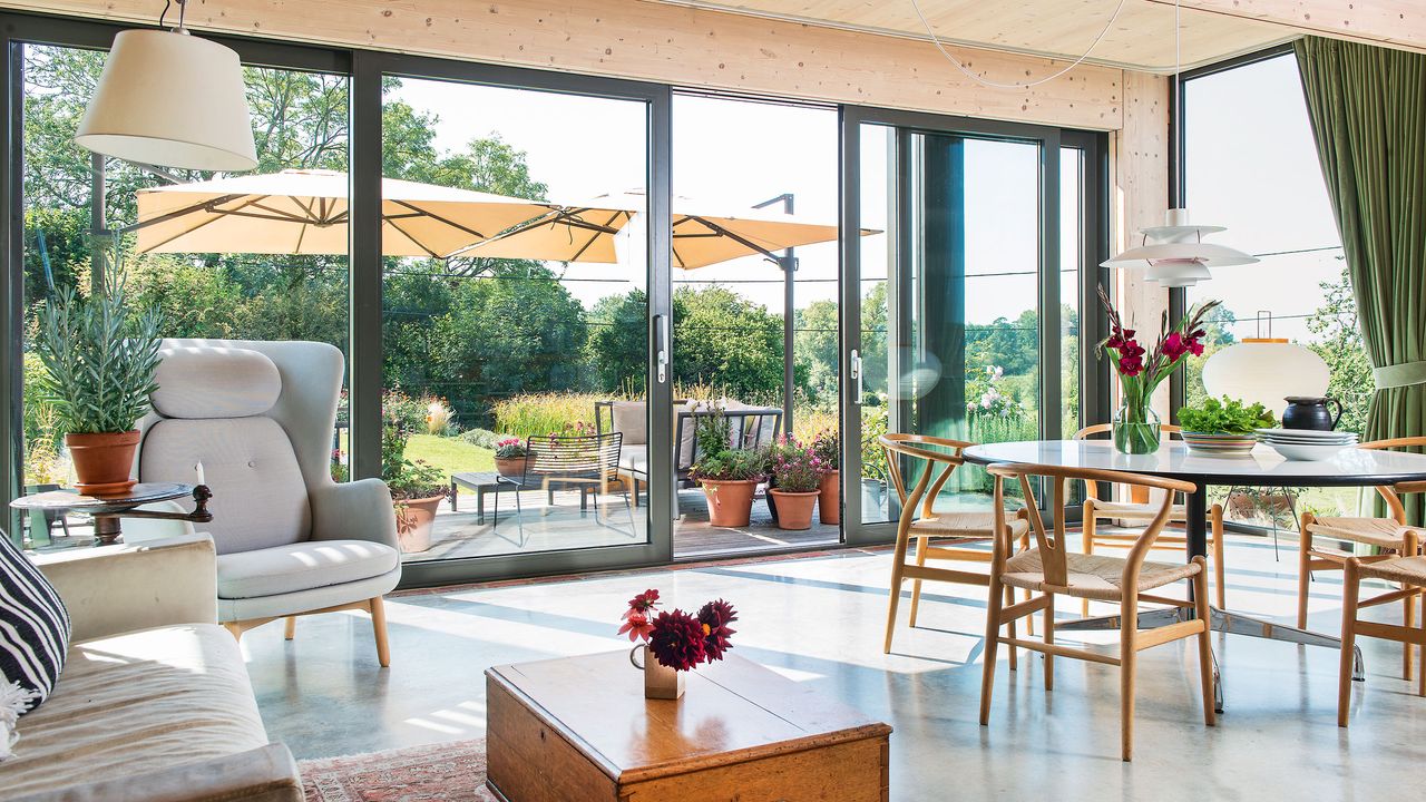 Open plan living and dining area with sliding doors