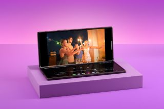 Samsung Galaxy Z Fold8 Ultra half-open to watch film with controls on the bottom half of screen