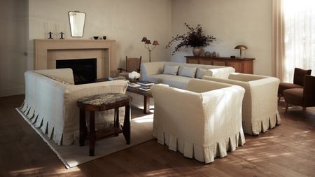 neutral living room with vintage furniture and wood floor