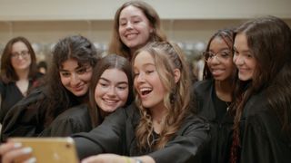 This is an image of a group of young women taking a group selfie in the documentary film “Girls State"