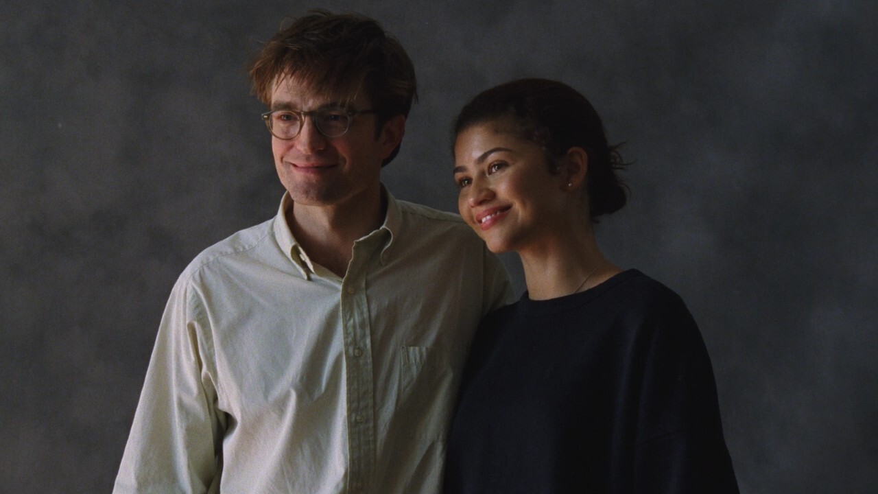 Robert Pattinson and Zendaya posing for a picture in The Drama