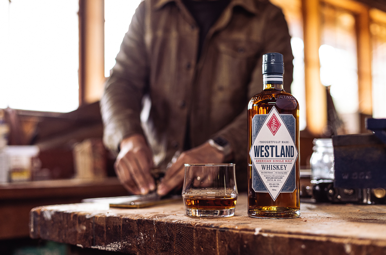 A bottle of Westland Whisky on a bar top