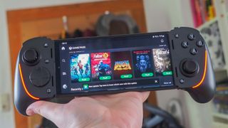 Razer Kishi Ultra being held up in the air. 