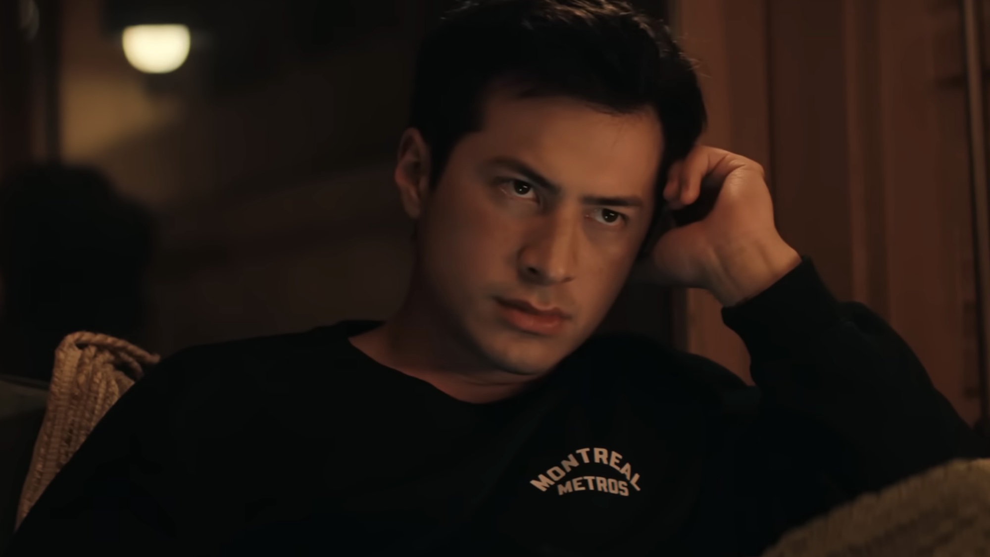 Shane looking concerned in The Cottage on Heated Rivalry.