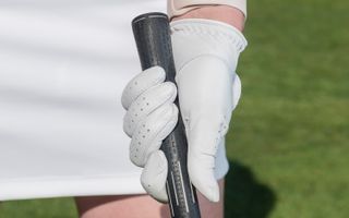 PGA pro Jo Taylor gripping a golf club with her left hand