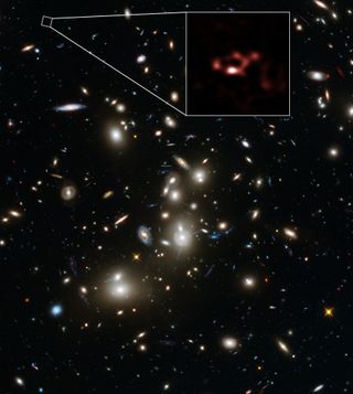 The galaxy cluster Abell 2744, also known as Pandora's Cluster, as seen from the Hubble Space Telescope. Far beyond this cluster is the faint, young galaxy A2744_YD4. New observations of this galaxy done using ALMA, shown in red, reveal that it is rich in ancient stardust.