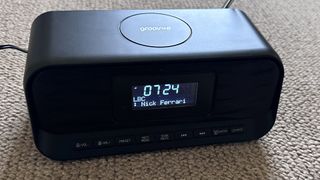 The Groov-E-Zeus DAB FM radio clock against carpet