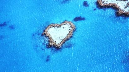 heart shaped island in blue ocean 