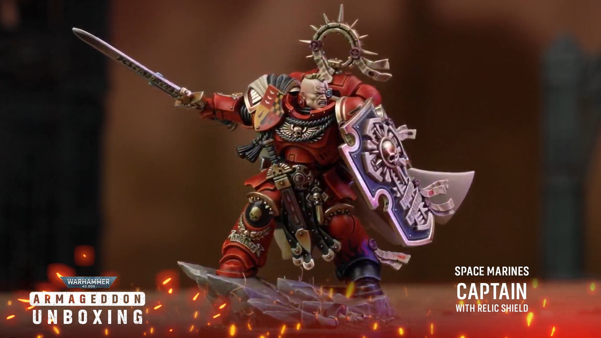 Warhammer 40K Space Marine models on a rocky battlefield