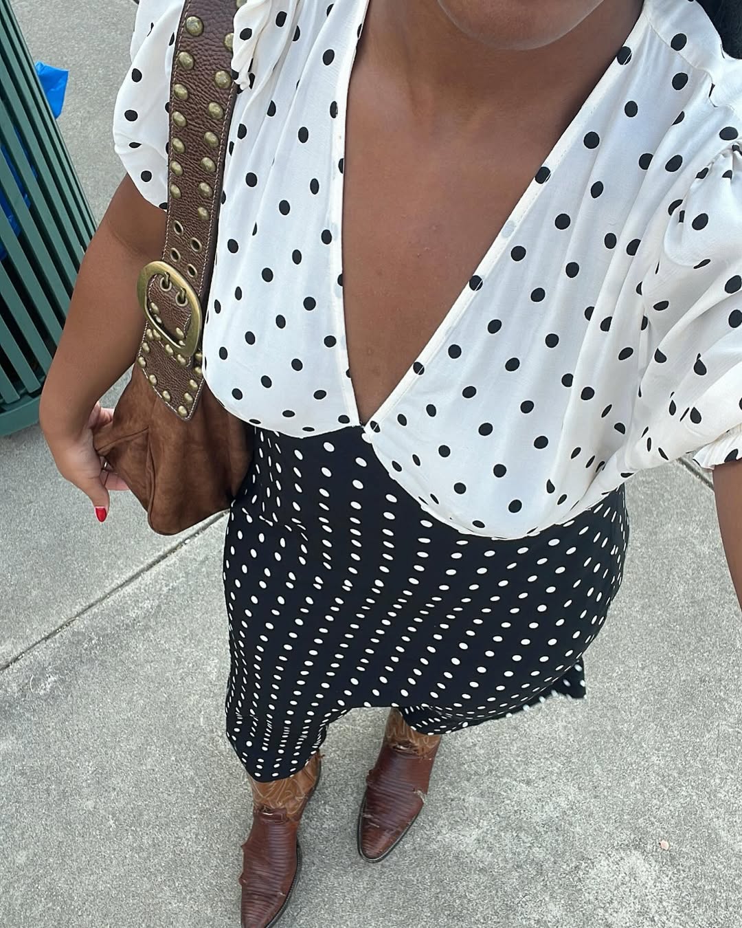Woman wearing fall brown suede bag trend.