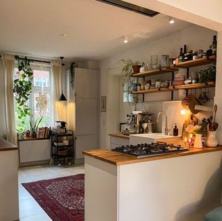 Small apartment kitchen with open shelving