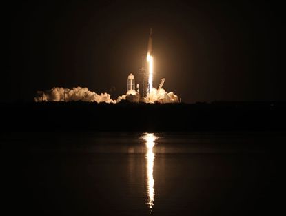 The Falcon 9 rocket lifts off from the Kennedy Space Center.