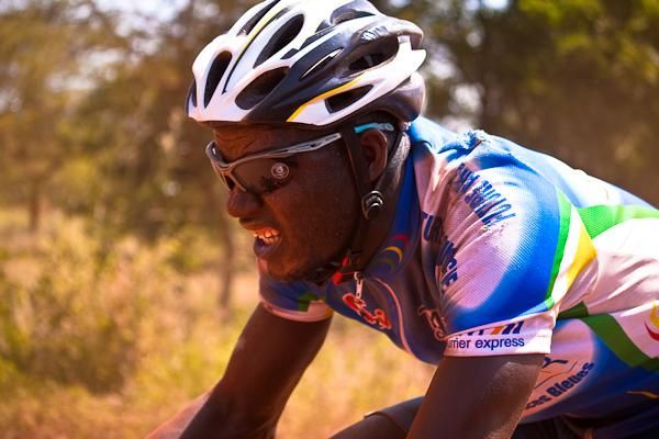 A Malian rider pushes through to the dusty finish.