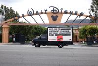 Walt Disney studios and a sign urging it not to cave into demands for censor Jimmy Kimmel