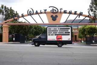 Walt Disney studios and a sign urging it not to cave into demands for censor Jimmy Kimmel