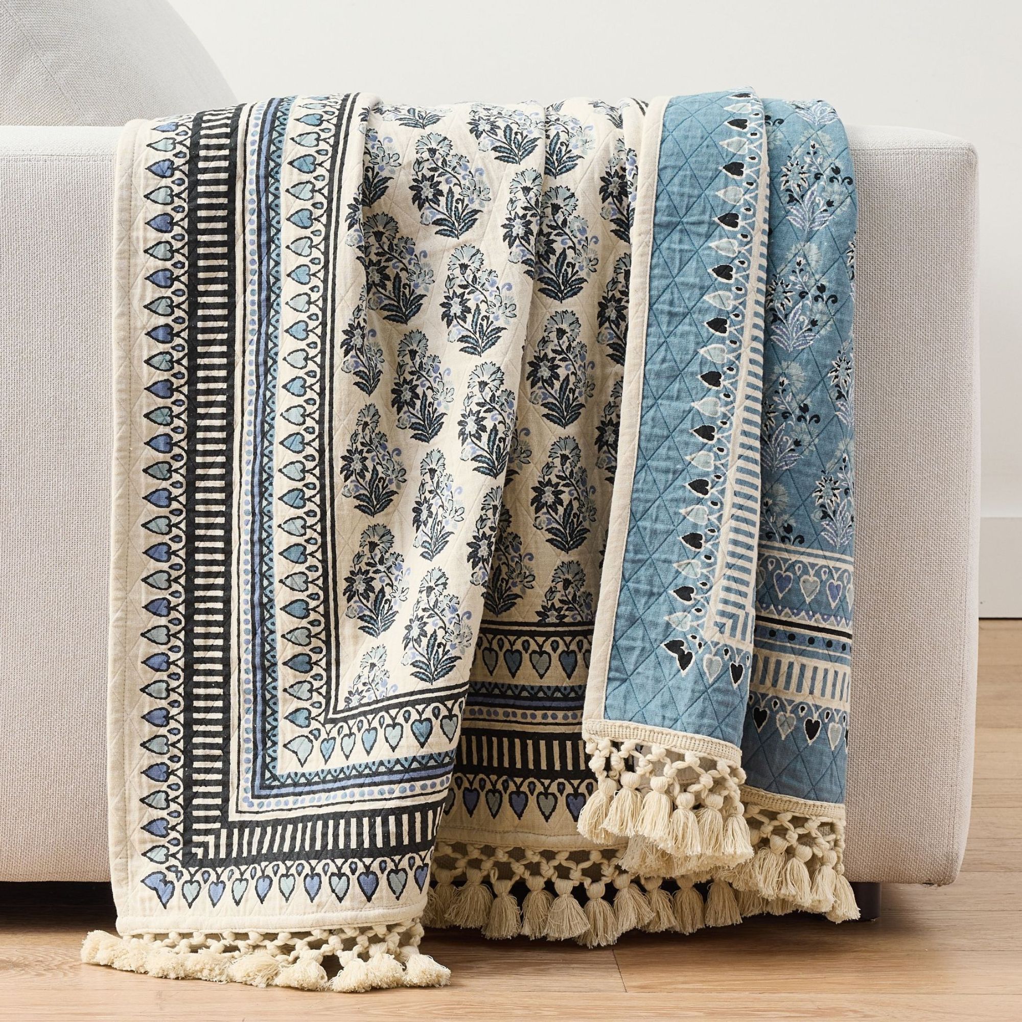 Blue patterned throw with tasselled edge