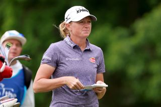 Stacy Lewis walks on with her yardage book in hand