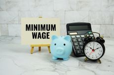 Minimum Wage text written on paper card
