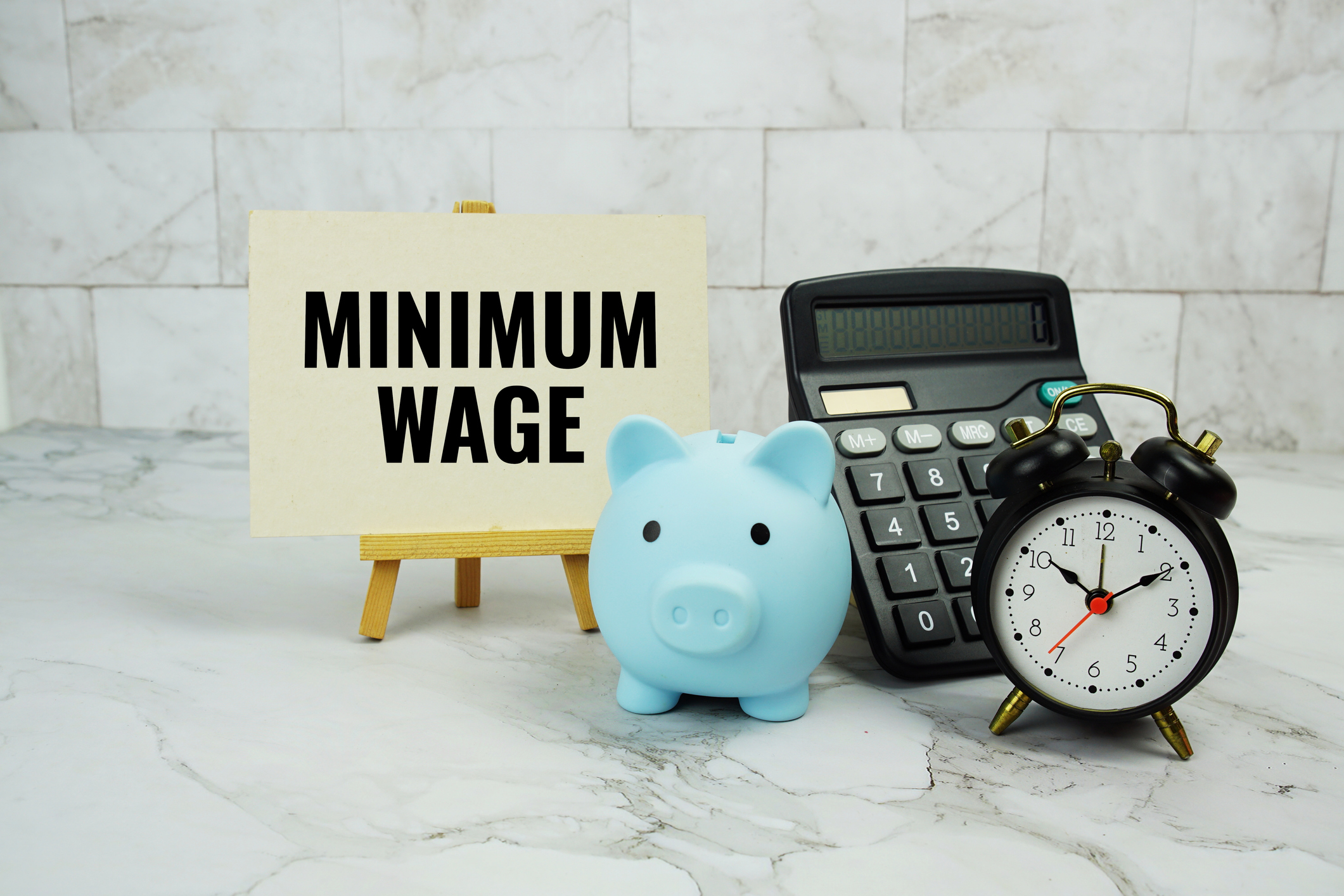 Minimum Wage text written on paper card