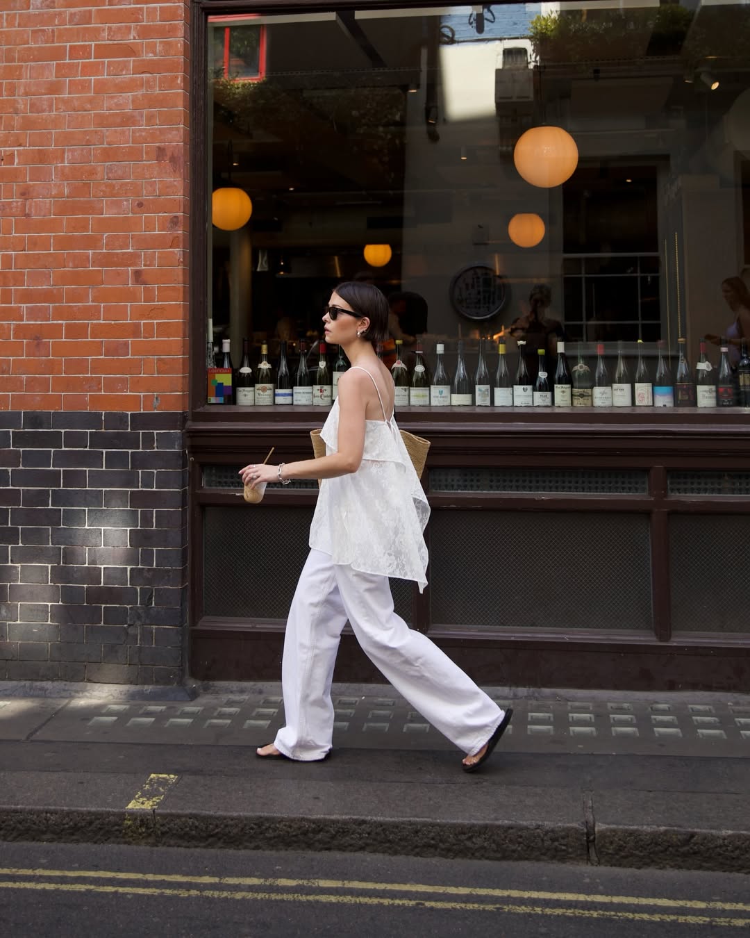 Alice in white lace top and white jeans