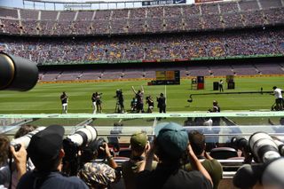 Photographers and fans watch as Robert Lewandowski is presented as a Barcelona player at Camp Nou in August 2022.