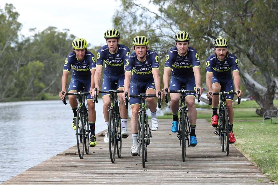 Some of the men's team, including Simon Gerrans and Mat Hayman ride out in the new kit