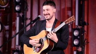 Marcus Mumford plays a Martin D-45, capo'd at the 7th fret