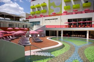 Pool with bright candy colored parasols