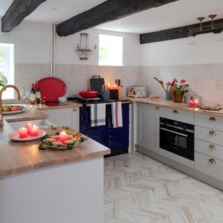 cottage kitchen with floor units, range cooker and ceiling beams