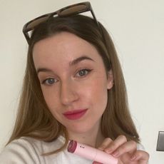 Grace Lindsay testing the Glossier lip créme