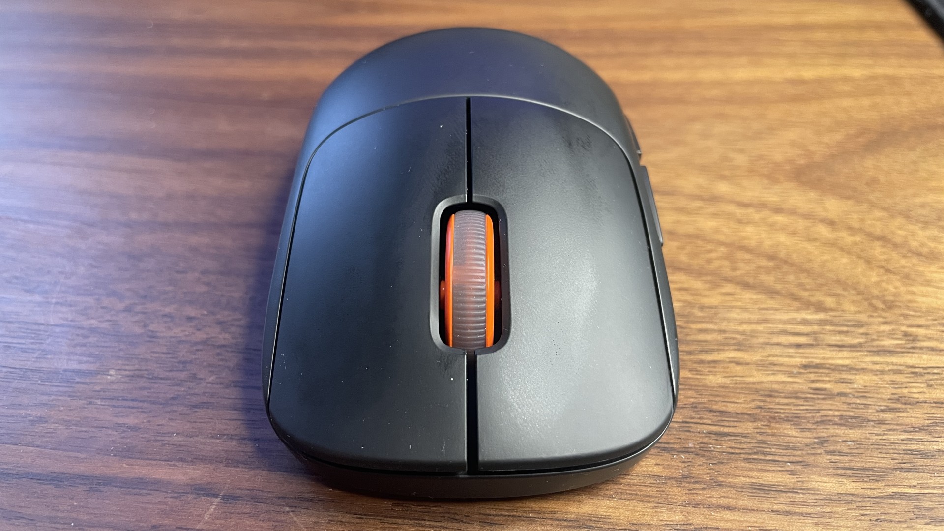 A SteelSeries Sensei Pro gaming mouse.