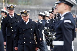 DARTMOUTH, ENGLAND - DECEMBER 16: Prince Charles, Prince of Wales and Admiral of the Fleet makes an inspection as he presides over the Lord High Admiral's Parade at Britannia Royal Naval College on December 16, 2021 in Dartmouth, England. (Photo by