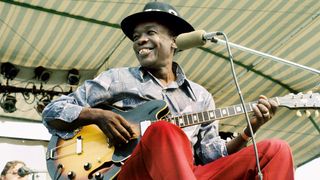 WINDSOR, ONTARIO - SEPTEMBER 8: Blues Artist John Lee Hooker performs at the Griffin Hollow Ampitheatre during the Ann Arbor Blues and Jazz Festival in Exile on September 8, 1974 in Windsor, Ontario.