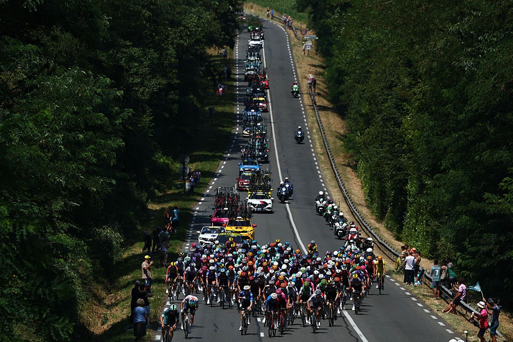 The pack of riders (peloton) cycles during the 6th stage of the 113th edition of the Tour de France cycling race, 186,2 km between Pau and Gavarnie-G&amp;egrave;dre in the French Pyrenees, on July 9, 2026. (Photo by Anne-Christine POUJOULAT / AFP)